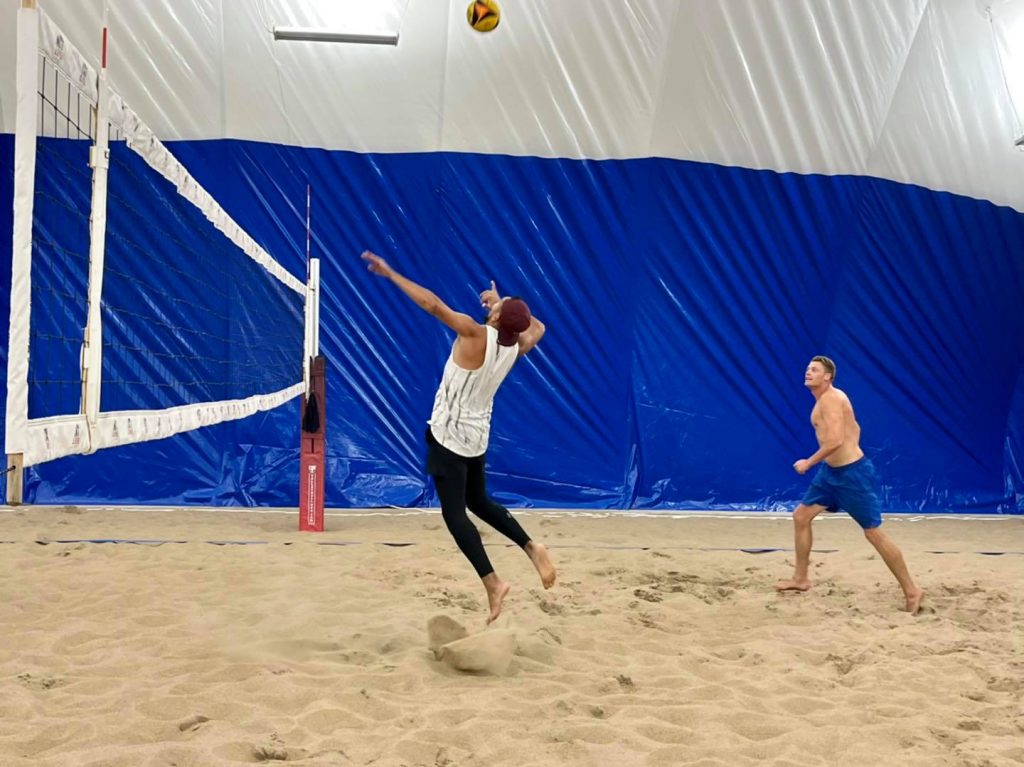 Volleyball player prepares to hit the ball during a game