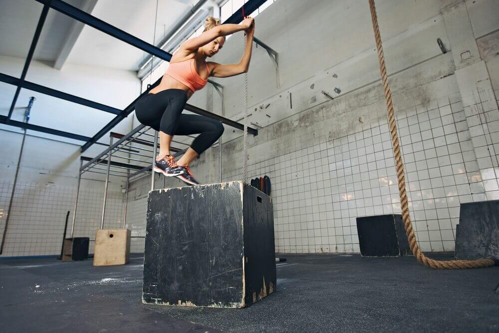A woman practicing box jumps