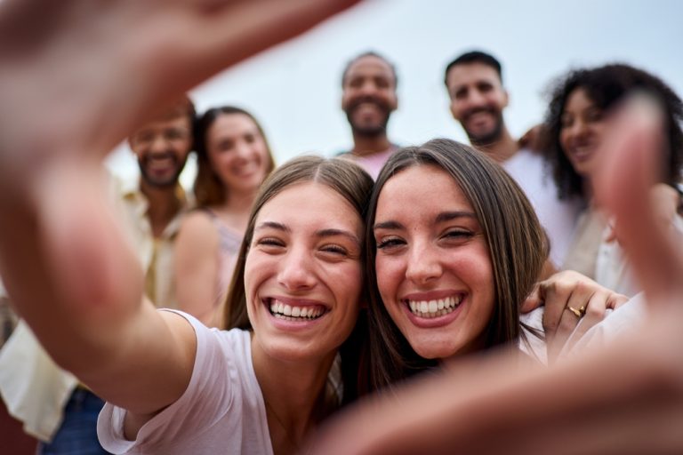 Smiling women having fun at an outdoor gathering